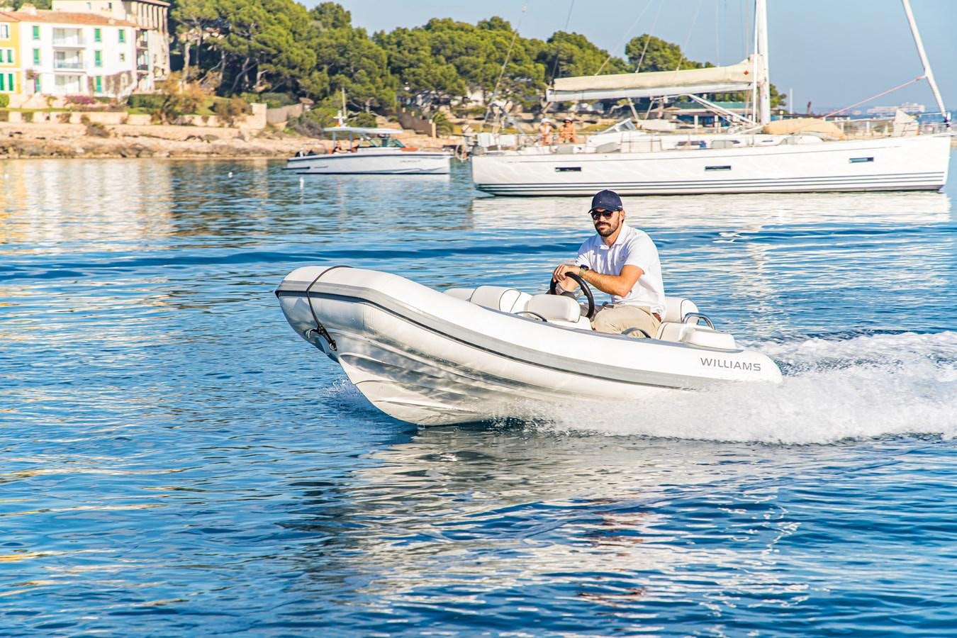 a man on a boat aboard BLUE M Yacht for Sale