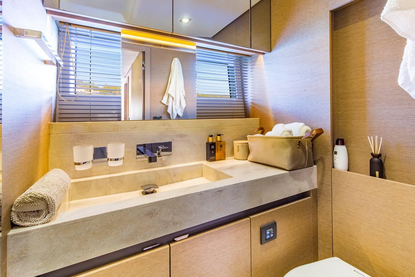 a bathroom with a large mirror aboard BLUE M Yacht for Sale