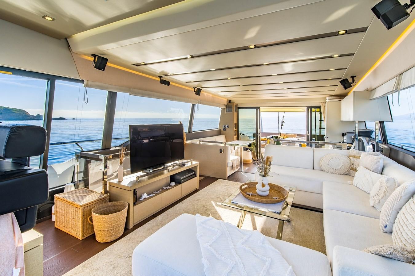 a living room with a large window aboard BLUE M Yacht for Sale
