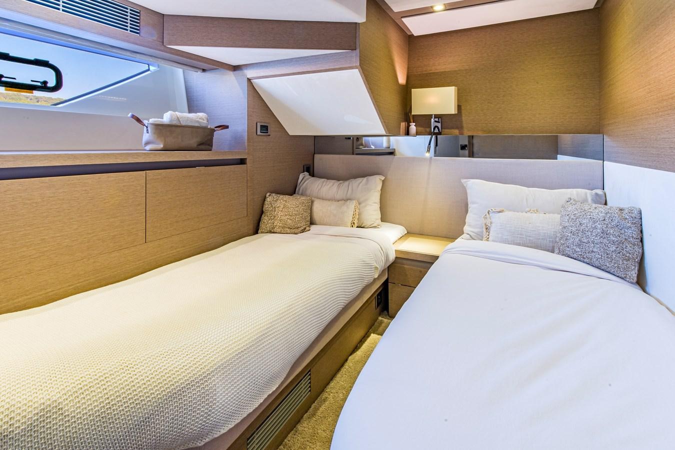 a room with two beds aboard BLUE M Yacht for Sale