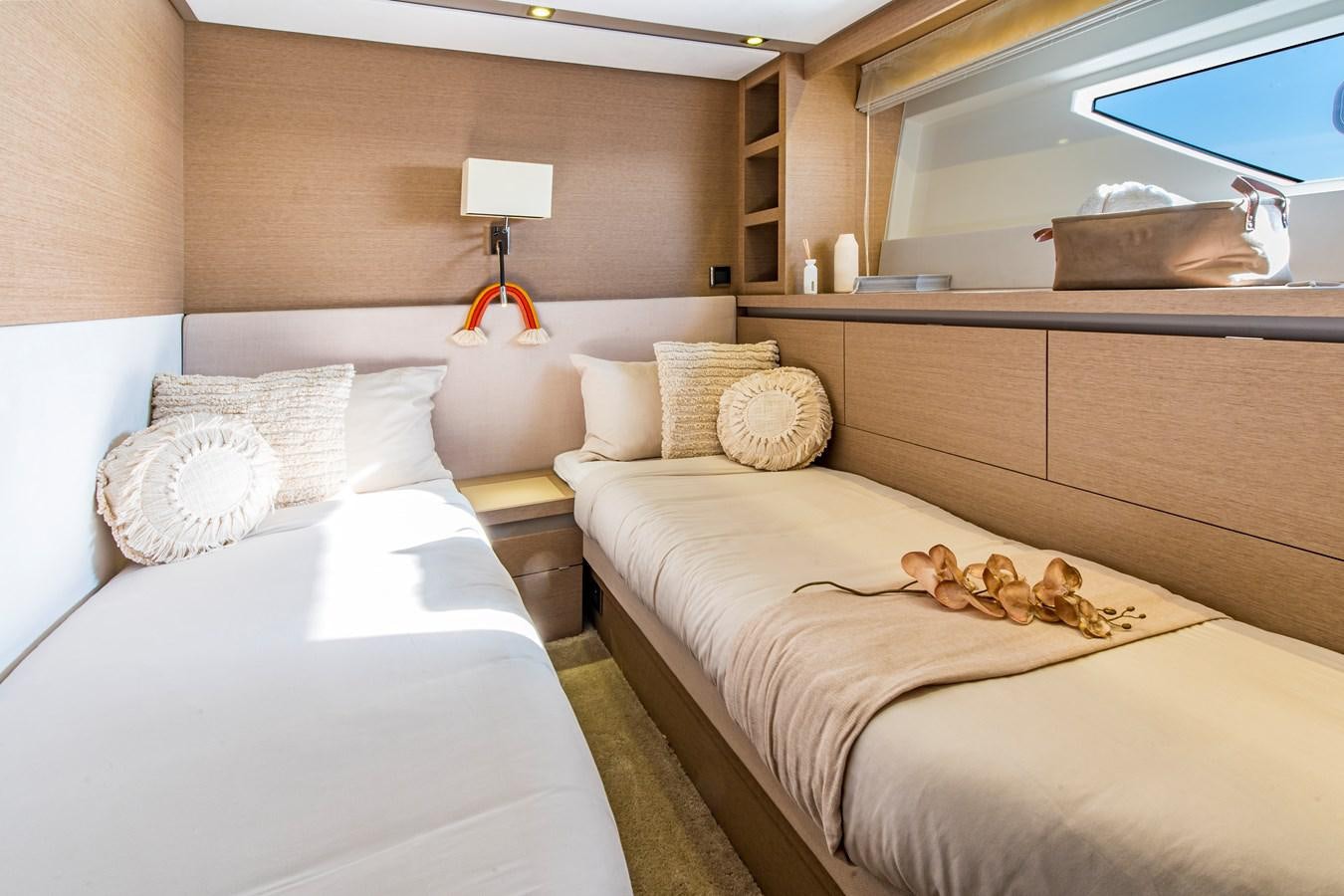 a room with a bed and a mirror aboard BLUE M Yacht for Sale