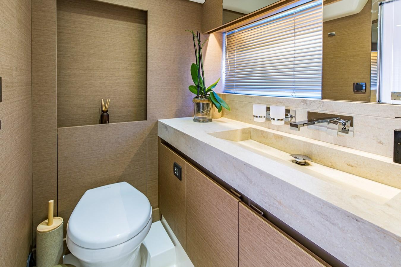 a bathroom with a sink and a toilet aboard BLUE M Yacht for Sale