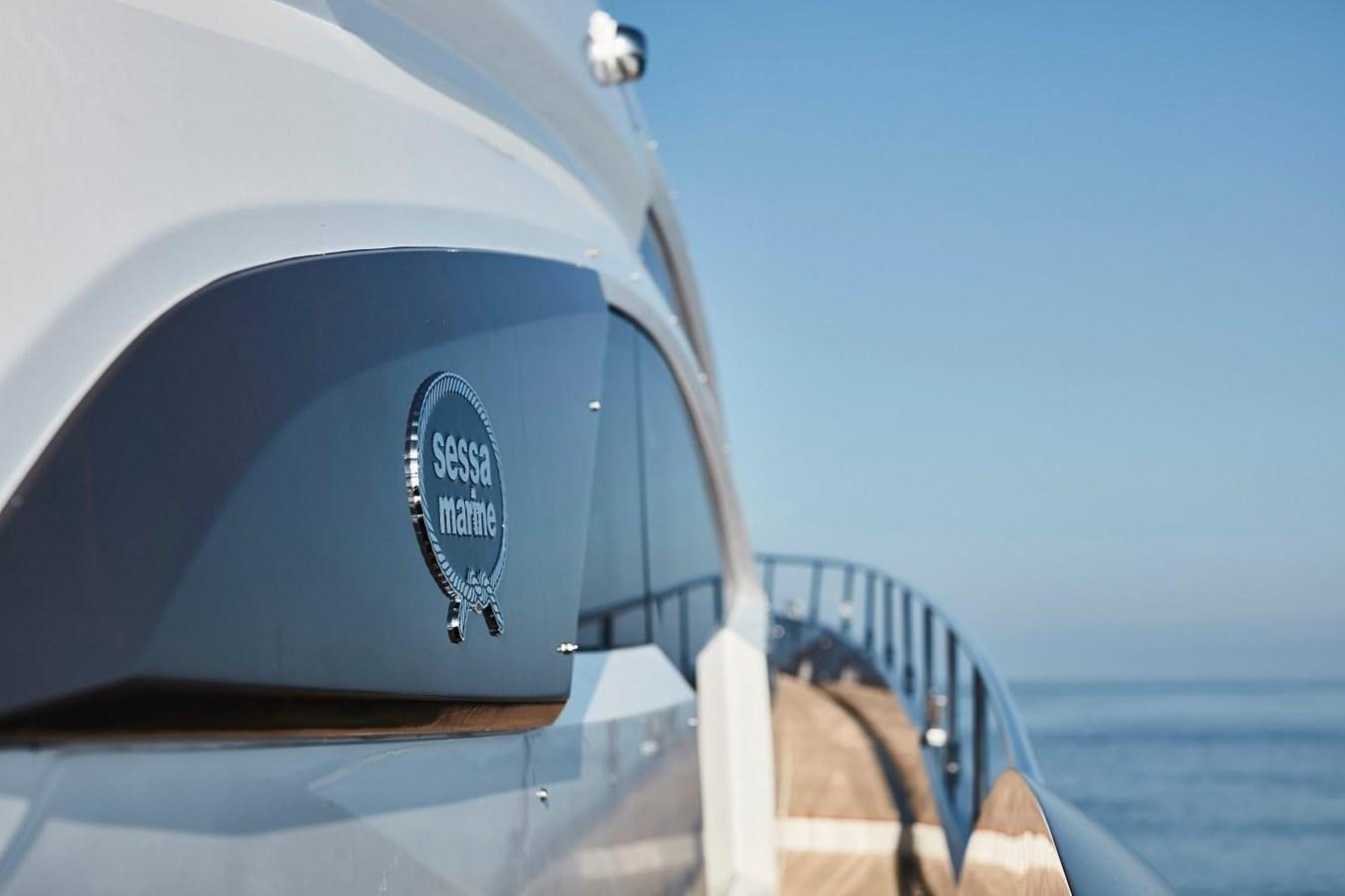 a car with a logo on the side aboard SESSA MARINE C68 Yacht for Sale