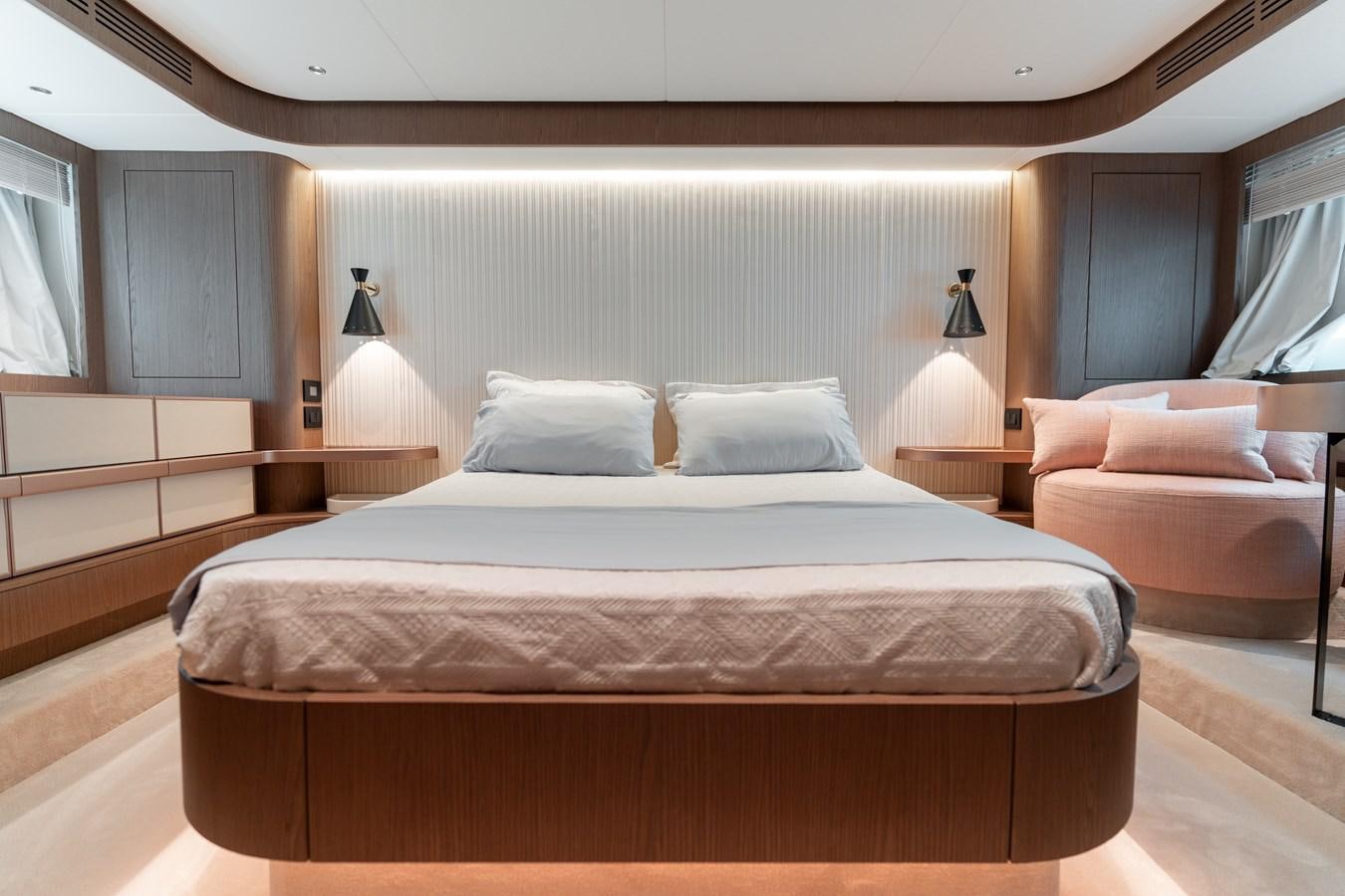 a bed with a white sheet aboard INIZIA Yacht for Sale