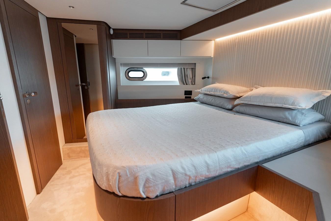 a bed in a room aboard INIZIA Yacht for Sale