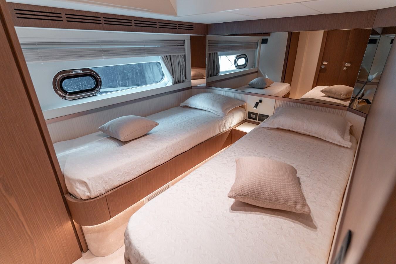 a room with two beds aboard INIZIA Yacht for Sale