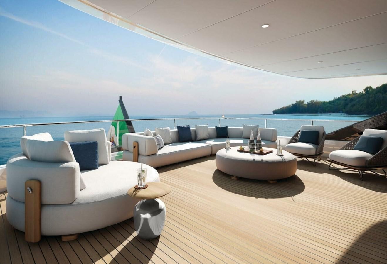 a living room with a large white couch and a large body of water aboard COSMICO Yacht for Sale