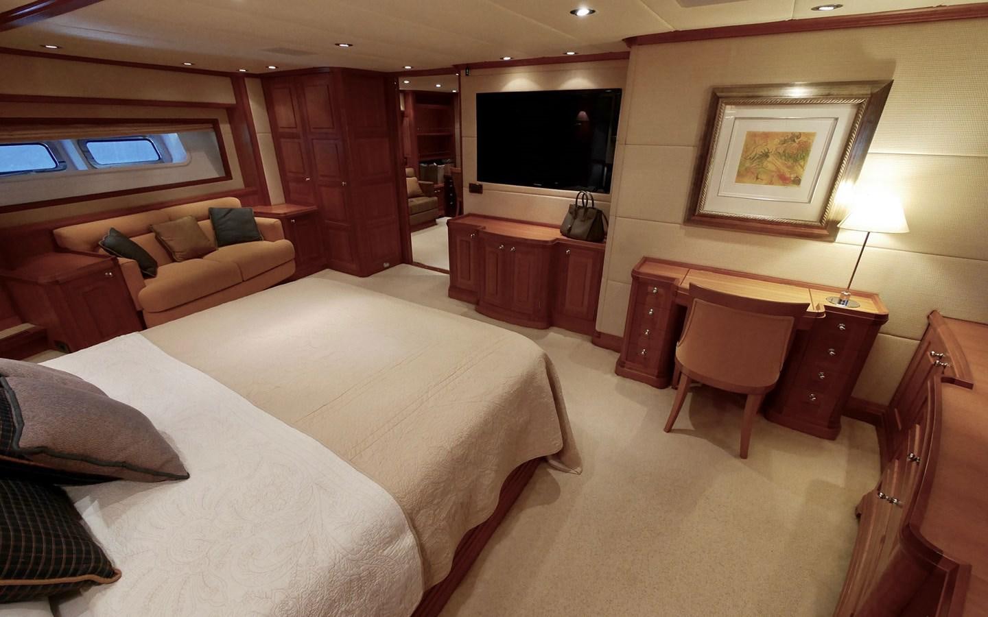 a hotel room with a bed and a tv aboard KOKOTEA Yacht for Sale