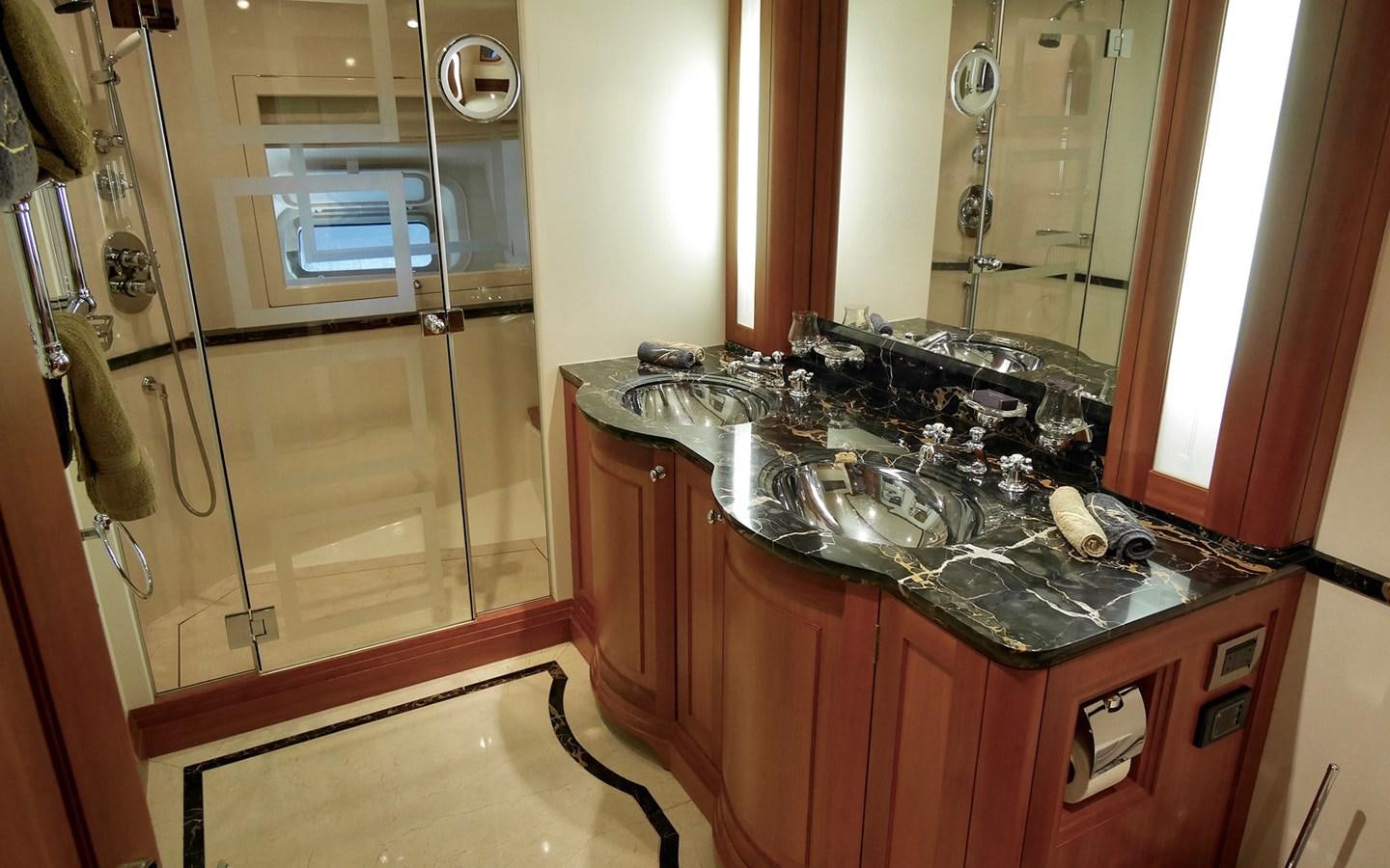 a bathroom with a sink and a mirror aboard KOKOTEA Yacht for Sale