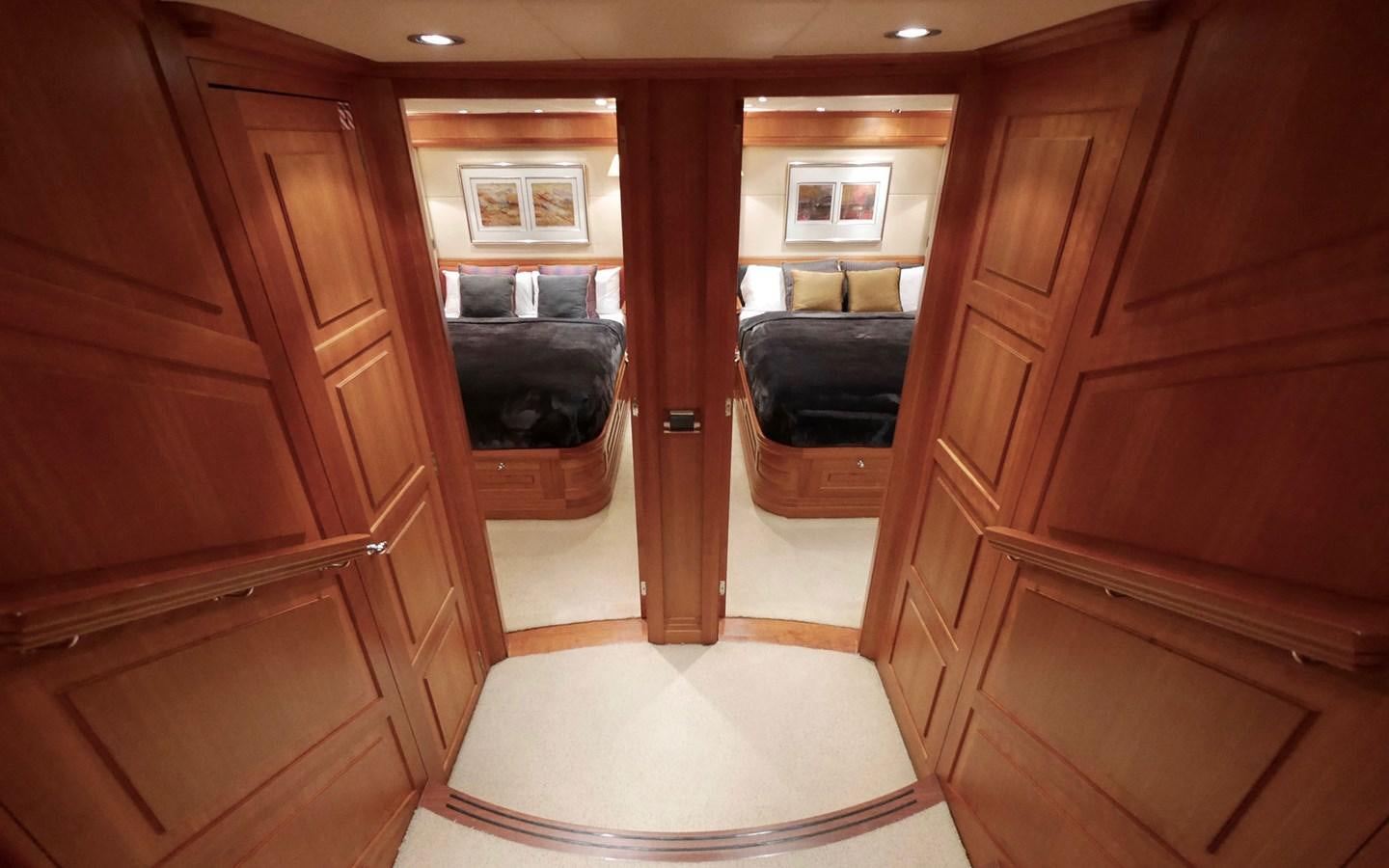a room with wooden cabinets aboard KOKOTEA Yacht for Sale