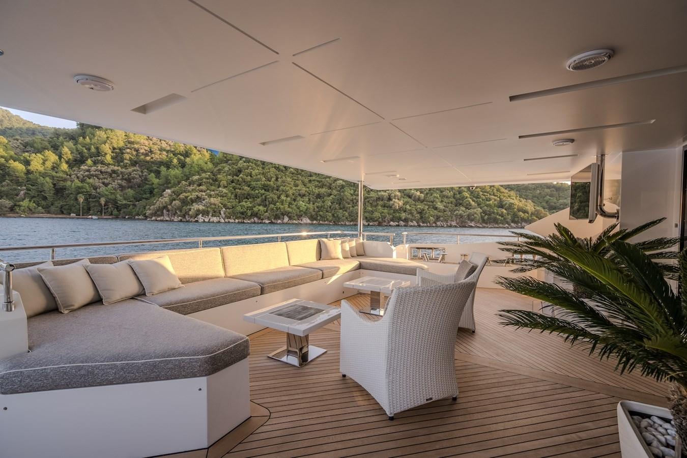 a living room with a large pool aboard CHARISMA Yacht for Sale