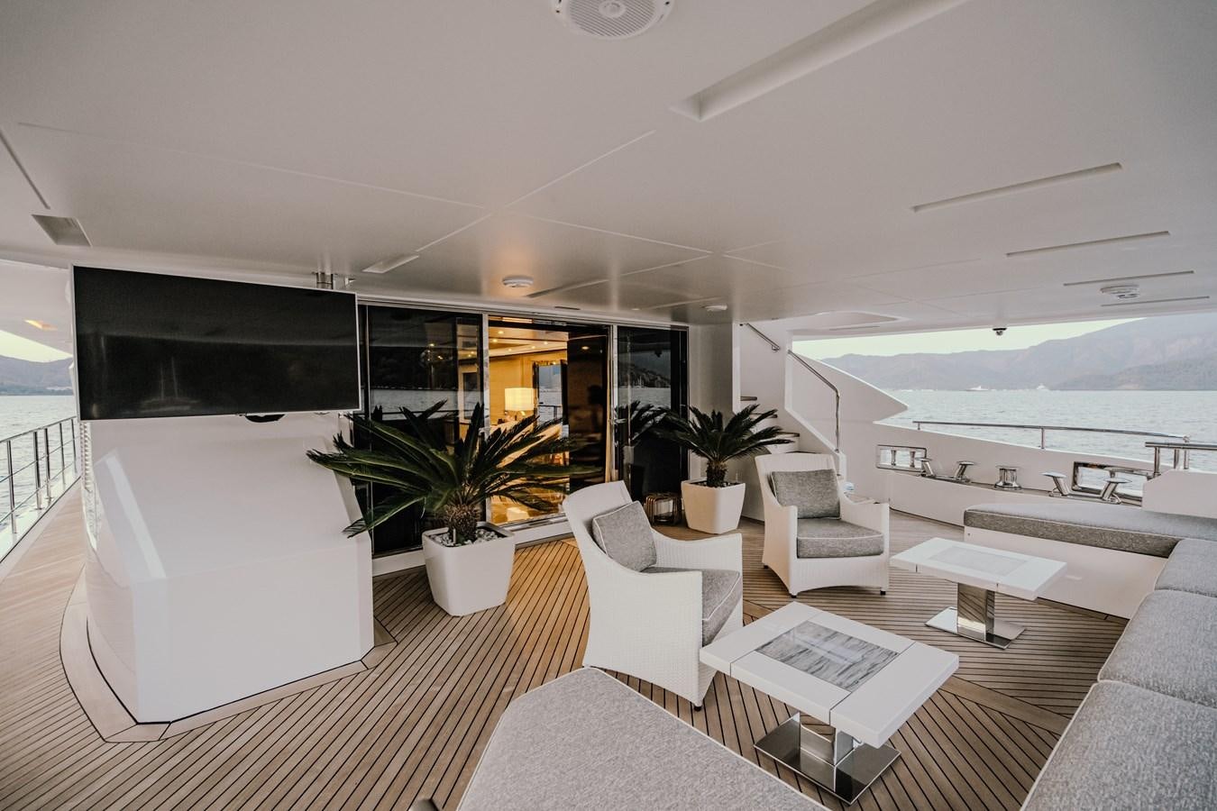 a modern looking living room with a large open floor plan aboard CHARISMA Yacht for Sale