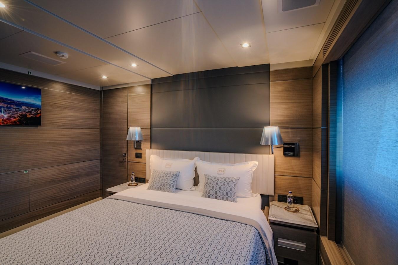 a bedroom with a large bed aboard CHARISMA Yacht for Sale