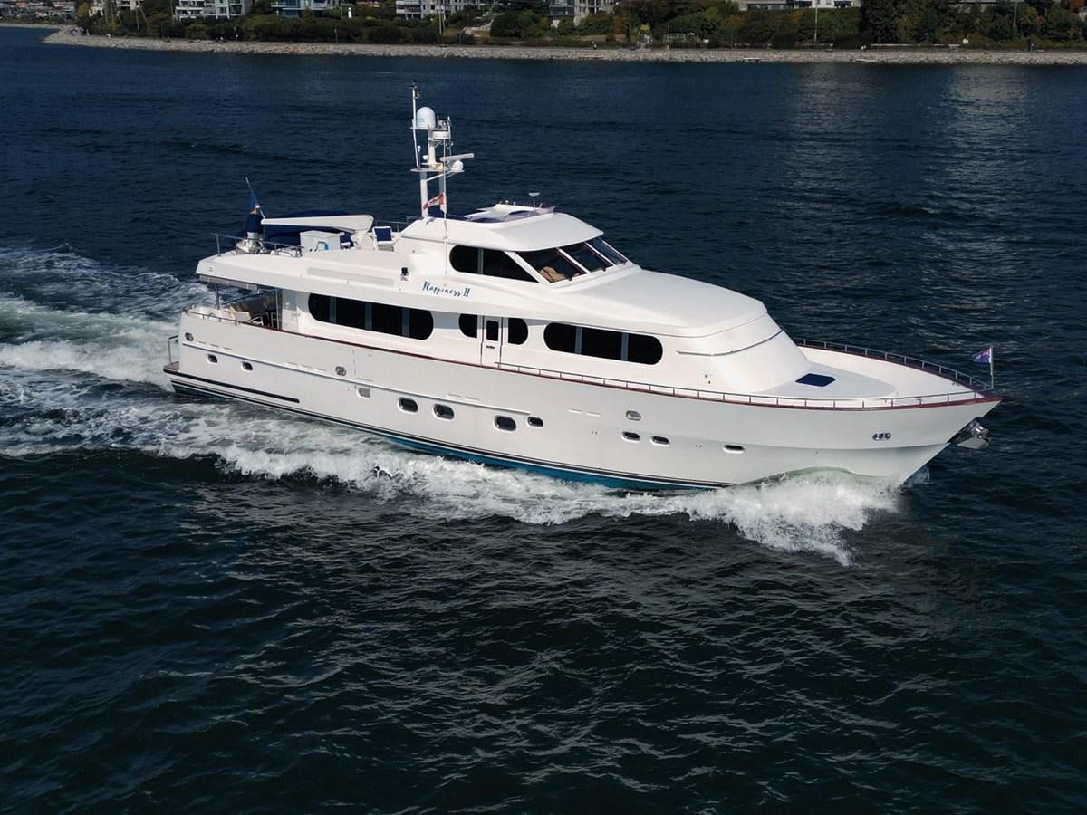 a white boat on the water aboard HAPPINESS II Yacht for Sale