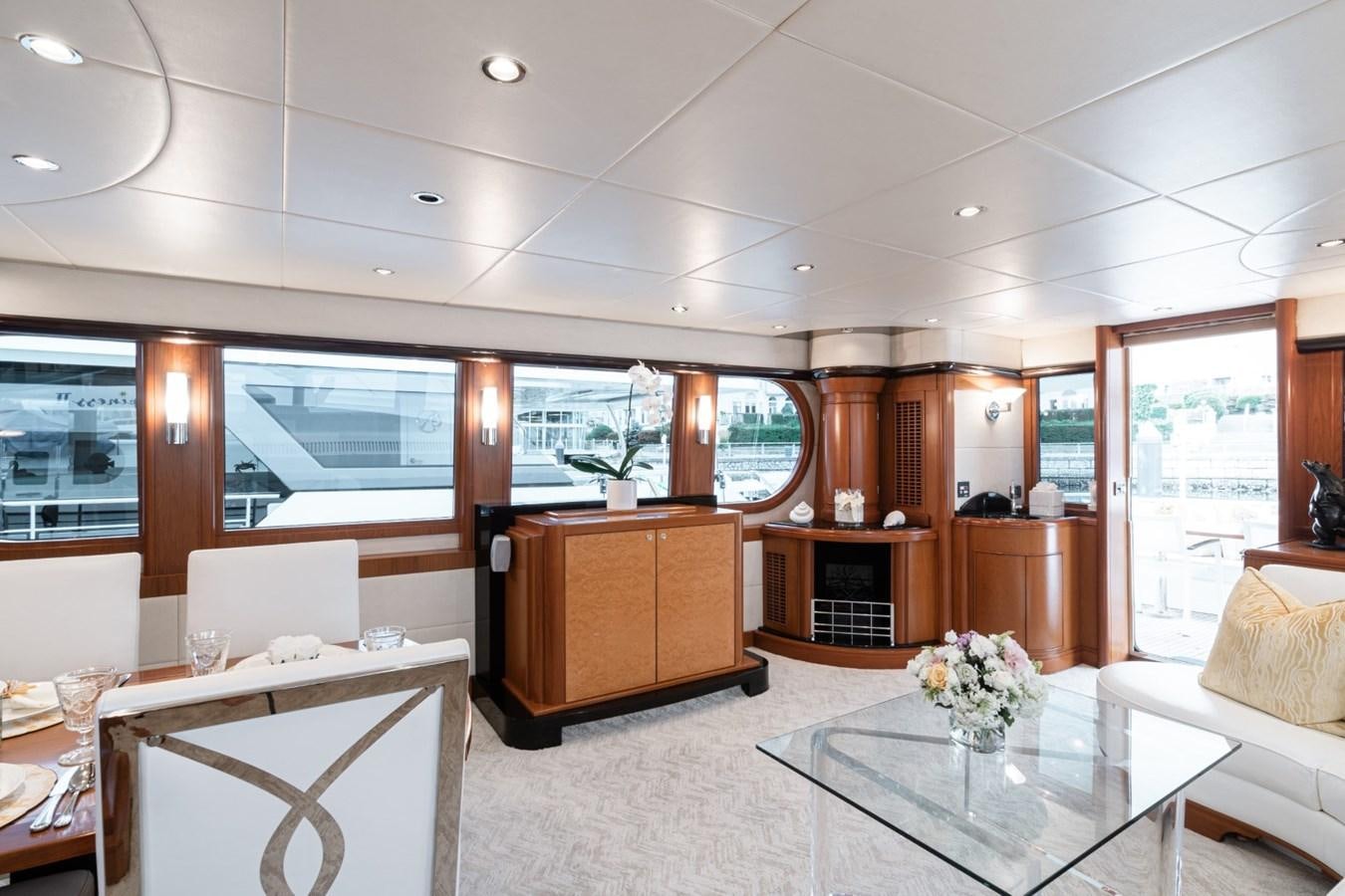 a living room with a large window aboard HAPPINESS II Yacht for Sale