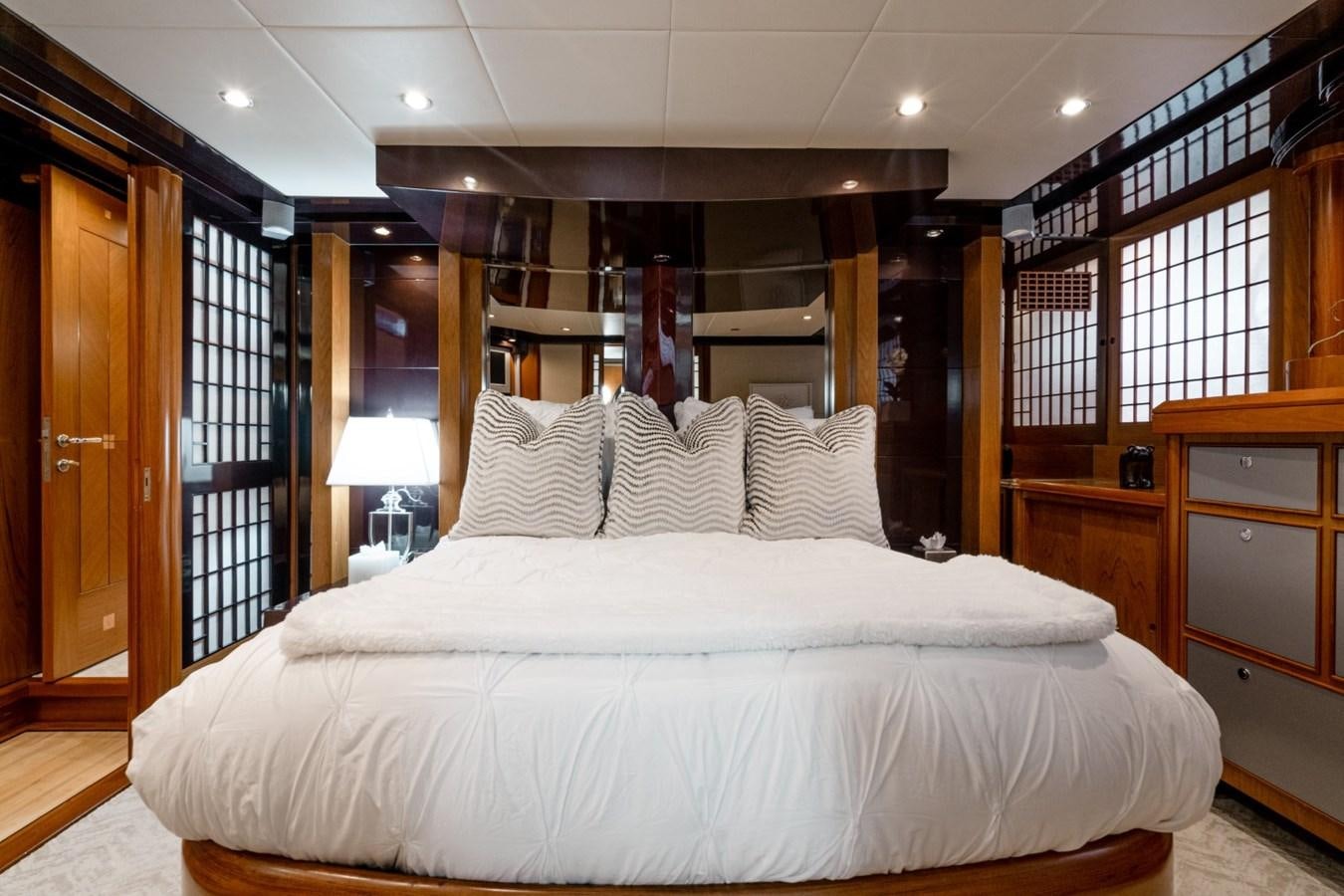 a large bed in a room aboard HAPPINESS II Yacht for Sale