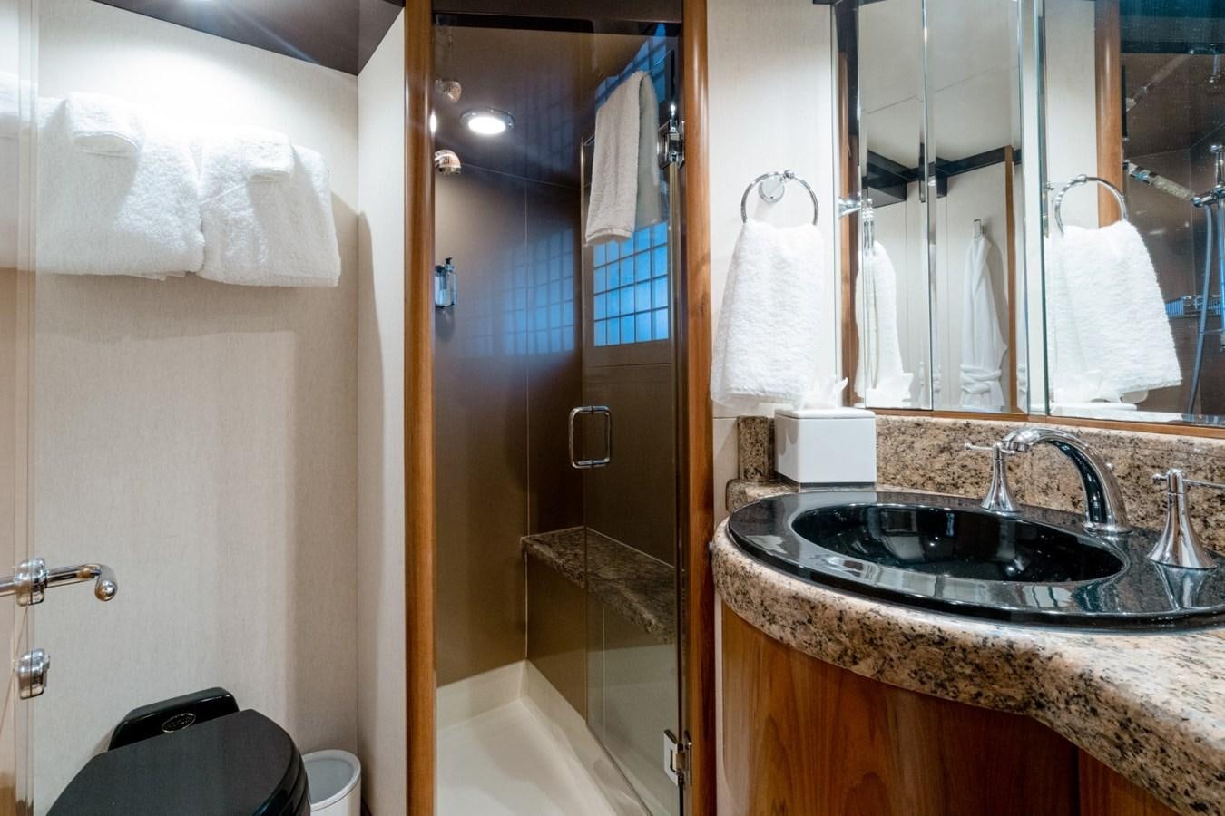 a bathroom with a sink and a mirror aboard HAPPINESS II Yacht for Sale