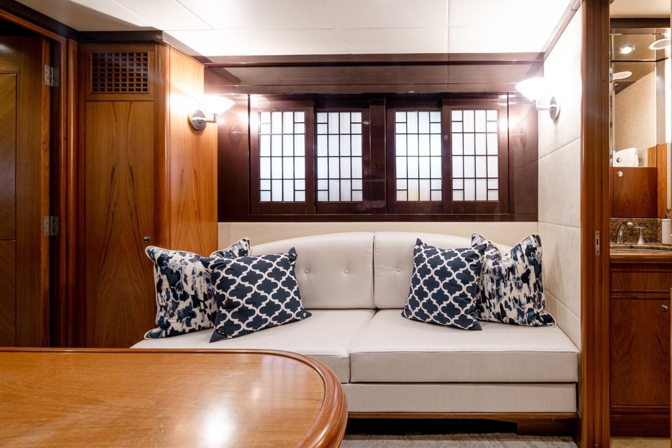 a white couch with pillows aboard HAPPINESS II Yacht for Sale