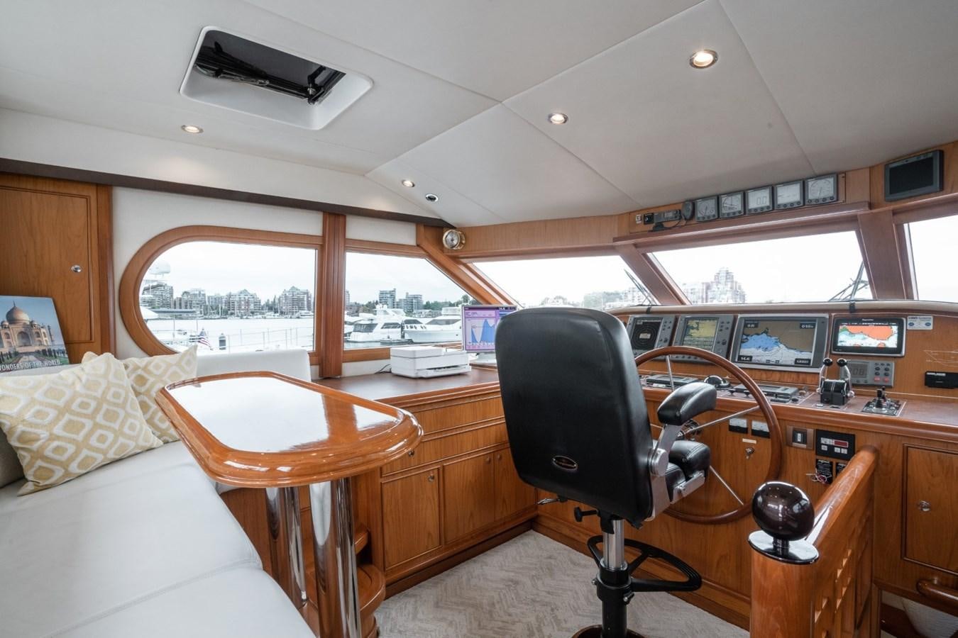 a room with a table and chairs aboard HAPPINESS II Yacht for Sale