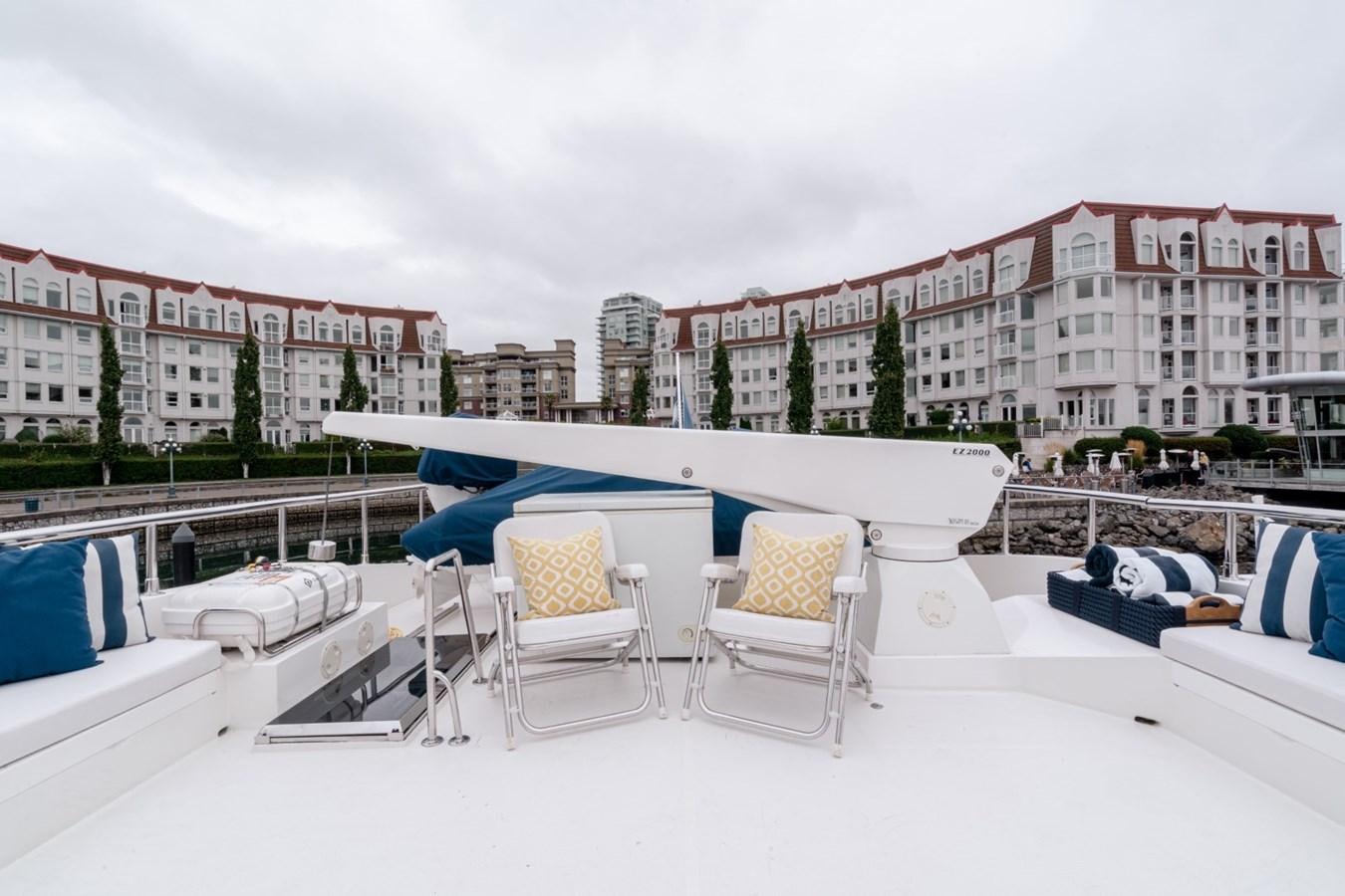a group of chairs and tables outside aboard HAPPINESS II Yacht for Sale