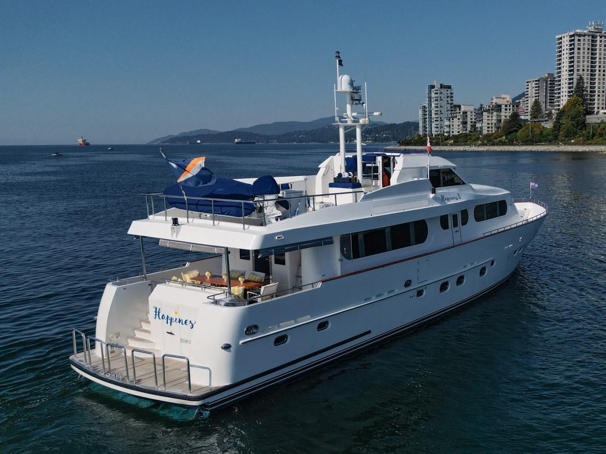 a large white boat in the water aboard HAPPINESS II Yacht for Sale