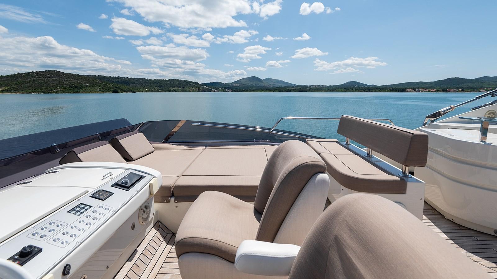a boat with seats and a steering wheel on the front aboard FRADI Yacht for Sale