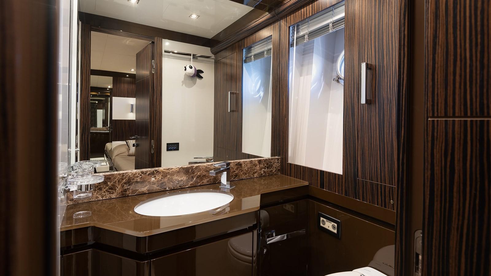 a bathroom with a large mirror aboard FRADI Yacht for Sale