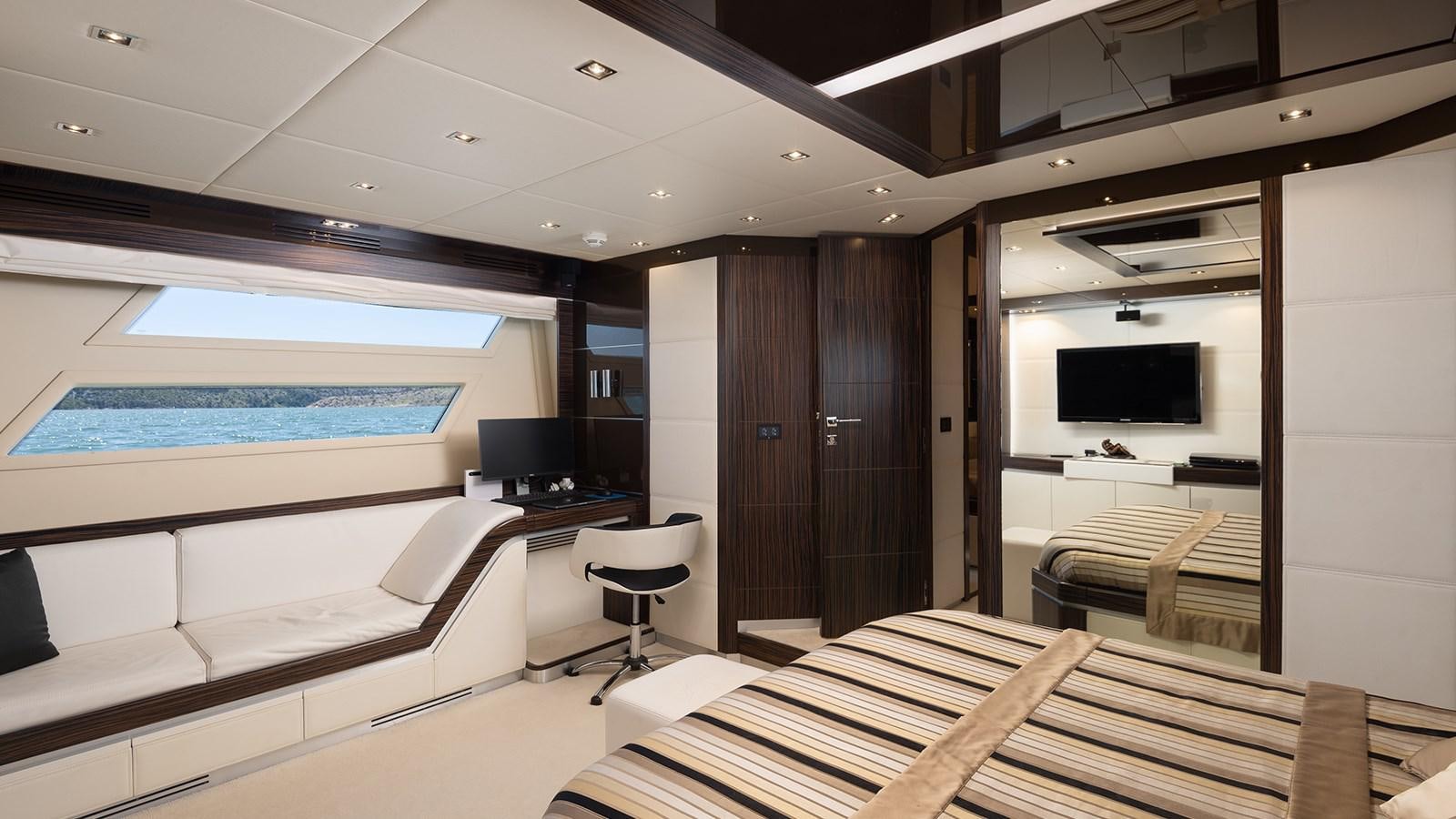 a room with a bed and a tv aboard FRADI Yacht for Sale
