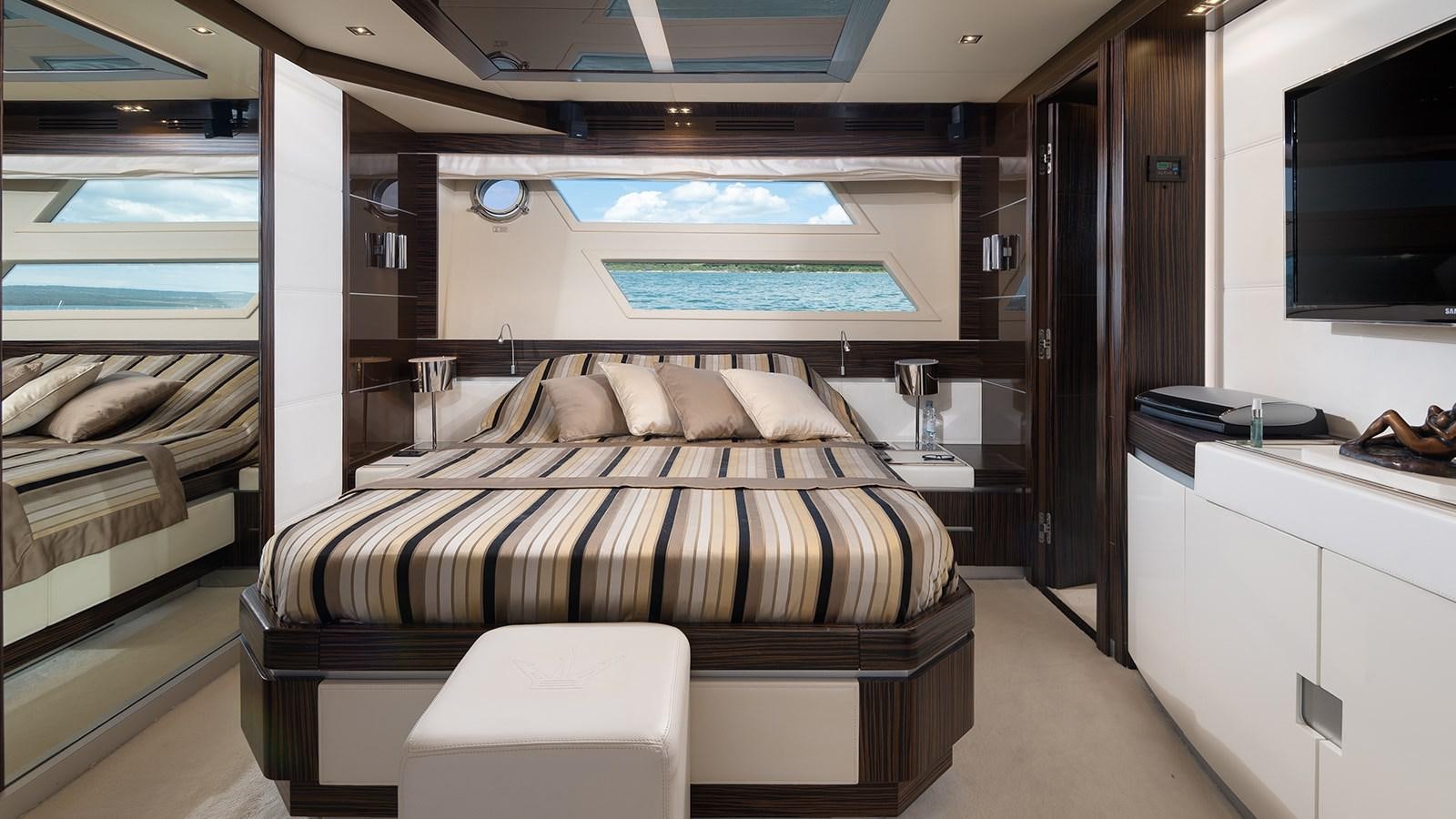 a room with a bed and a desk aboard FRADI Yacht for Sale