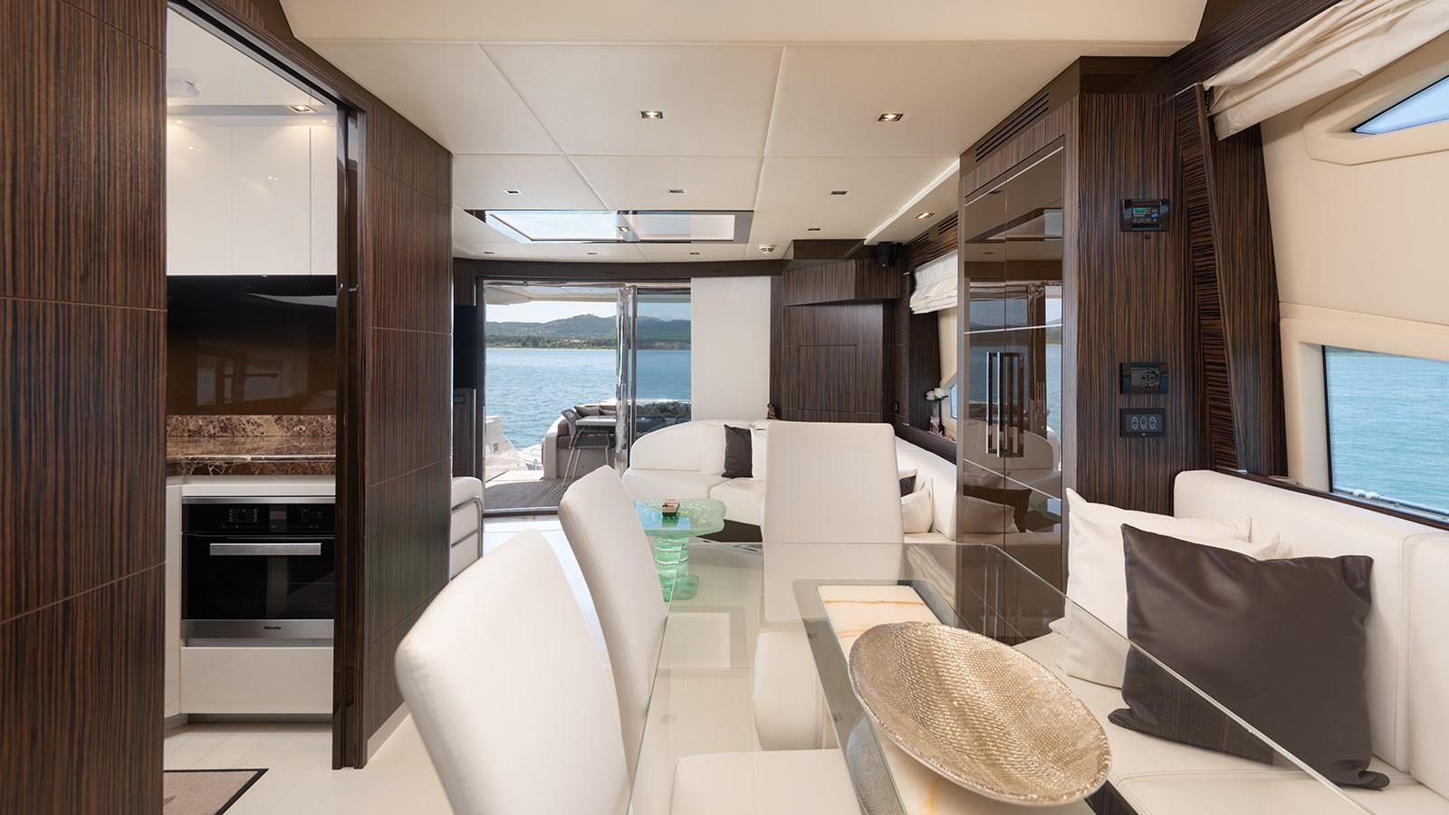 a room with a couch and a table and chairs aboard FRADI Yacht for Sale