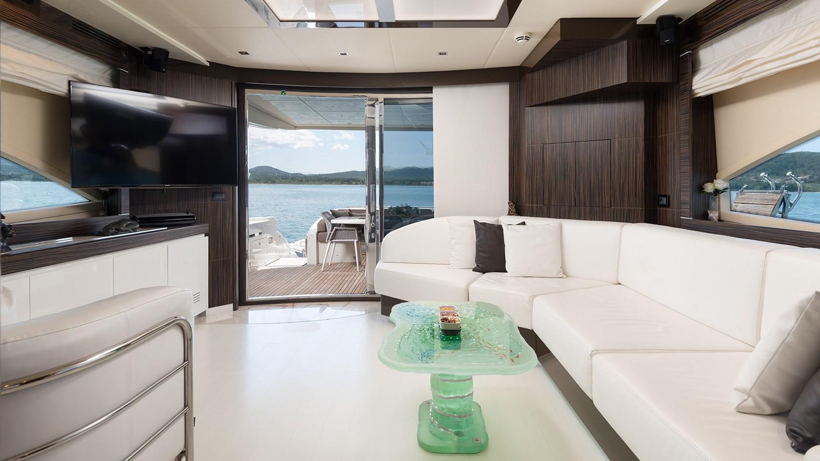a living room with a large window aboard FRADI Yacht for Sale