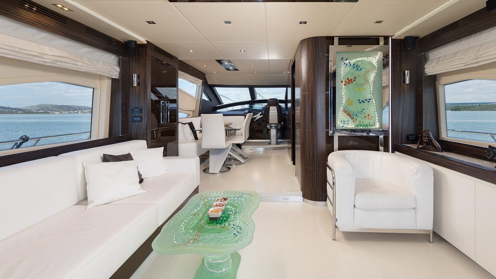 a room with a couch and a table aboard FRADI Yacht for Sale