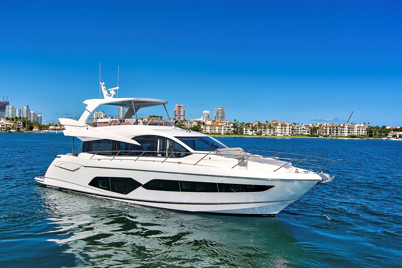 a white yacht in the water aboard EXIT Yacht for Sale