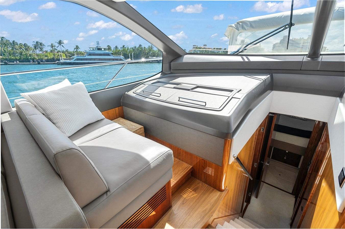 a room with a couch and a pool aboard EXIT Yacht for Sale