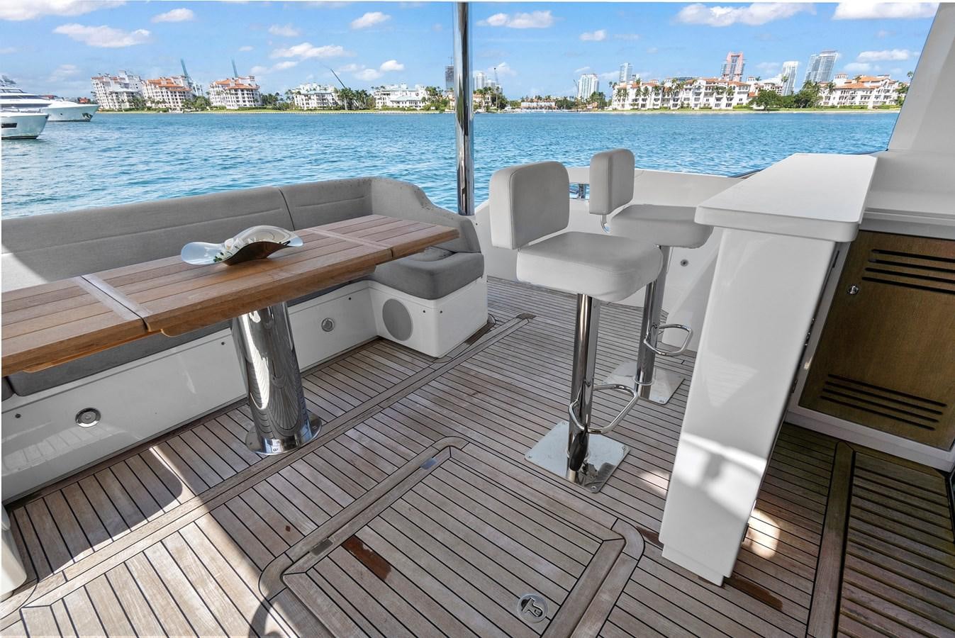 a room with a table and chairs aboard EXIT Yacht for Sale