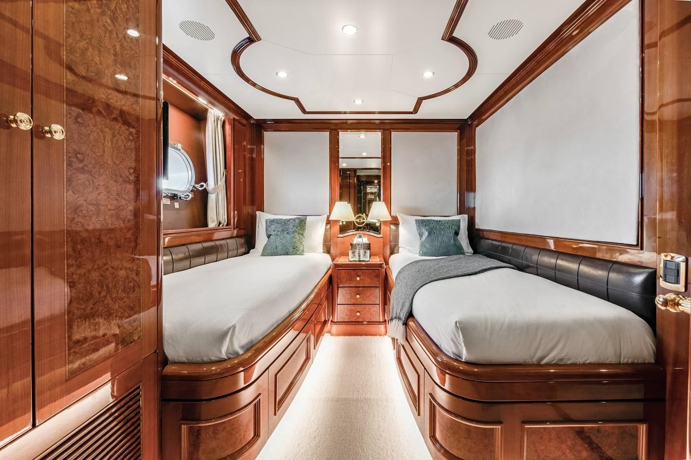 a room with a bed and a mirror aboard LOULOU Yacht for Sale