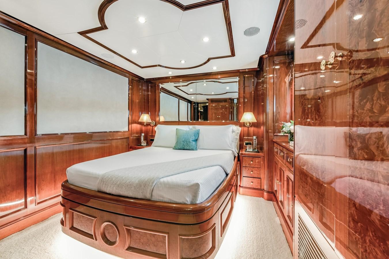 a large bedroom with a large bed aboard LOULOU Yacht for Sale