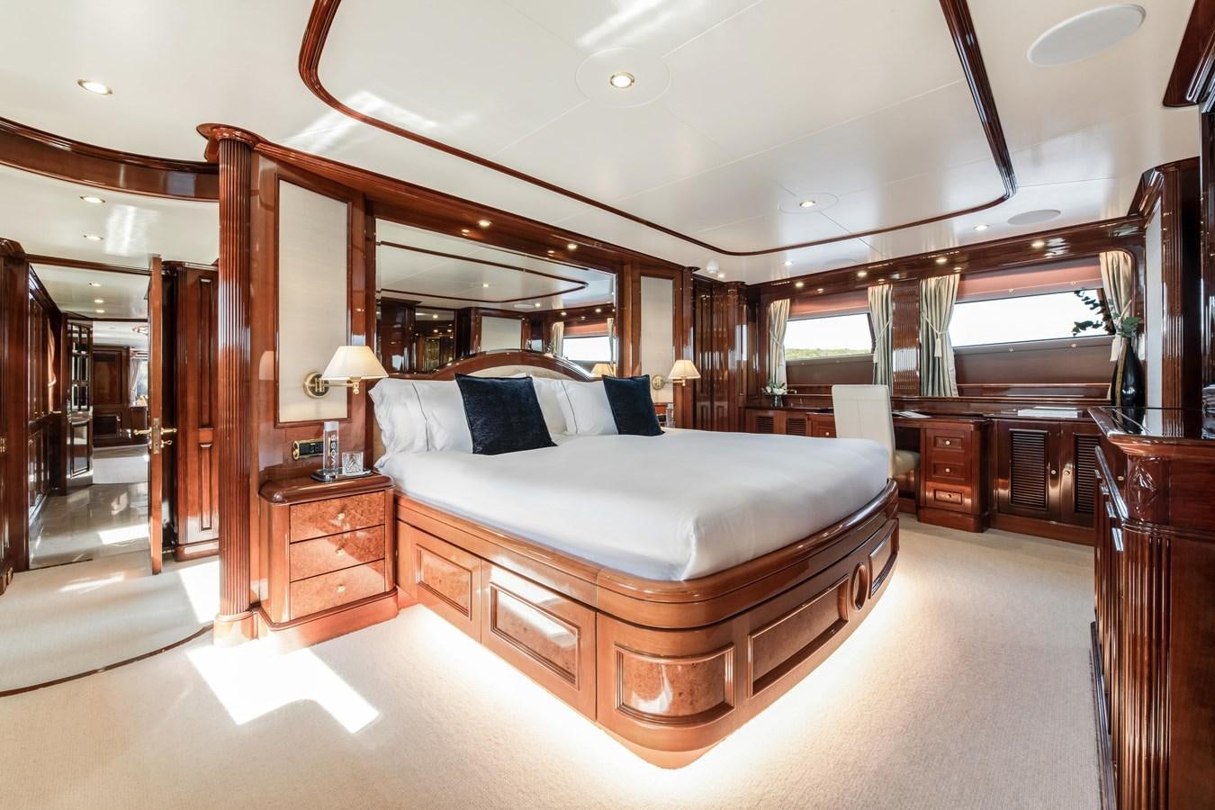 a large bedroom with a large bed aboard LOULOU Yacht for Sale