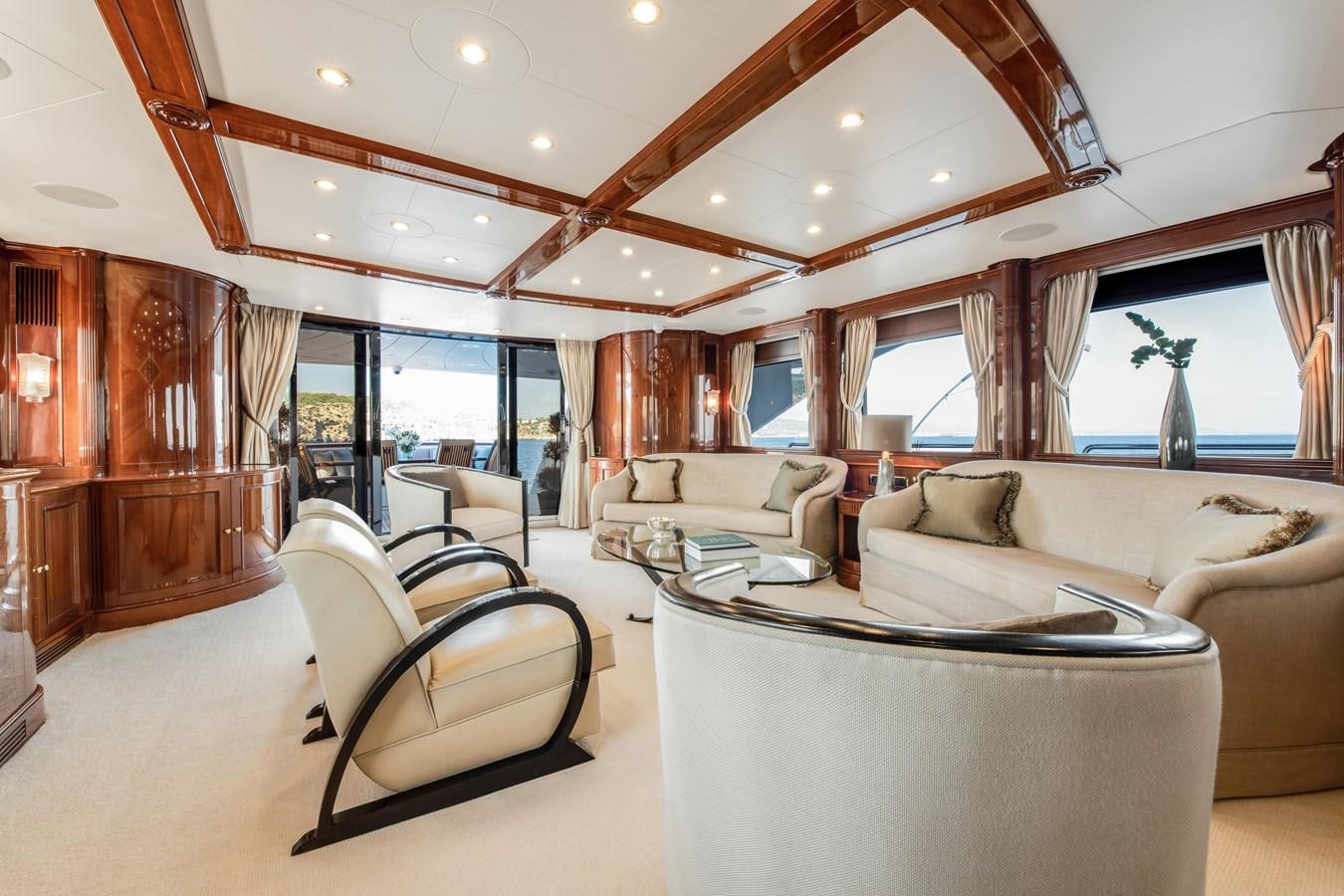 a living room with a large open ceiling aboard LOULOU Yacht for Sale