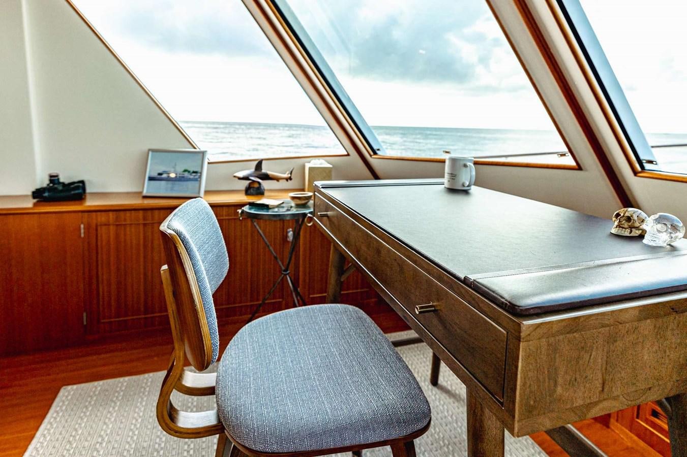 a room with a desk and a laptop aboard SEA BOLD Yacht for Sale