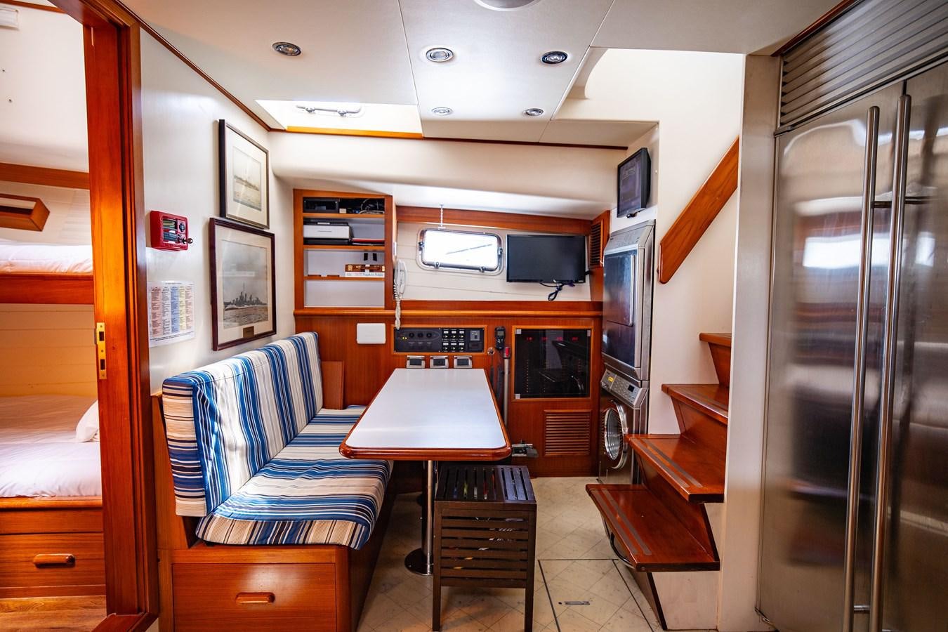 a room with a table and chairs aboard SEA BOLD Yacht for Sale