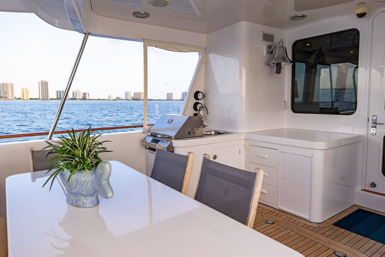 a white kitchen with a large window aboard SEA BOLD Yacht for Sale