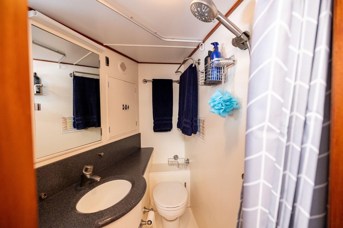 a bathroom with a sink and a toilet aboard SEA BOLD Yacht for Sale