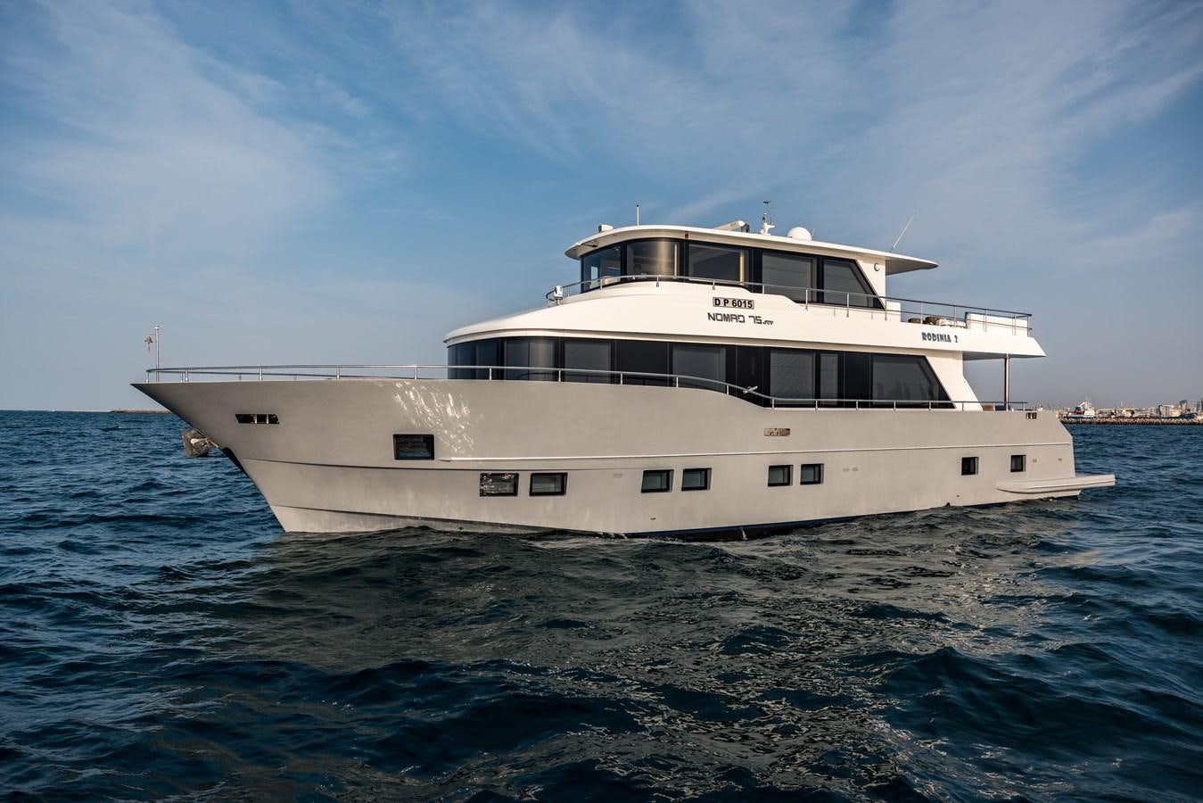 a white boat in the water aboard RODINIA 2 Yacht for Sale