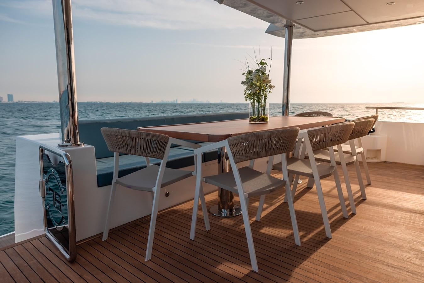 a table and chairs on a deck aboard RODINIA 2 Yacht for Sale