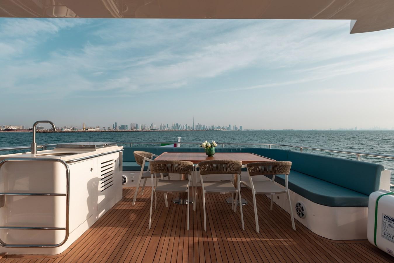 a table and chairs on a deck aboard RODINIA 2 Yacht for Sale