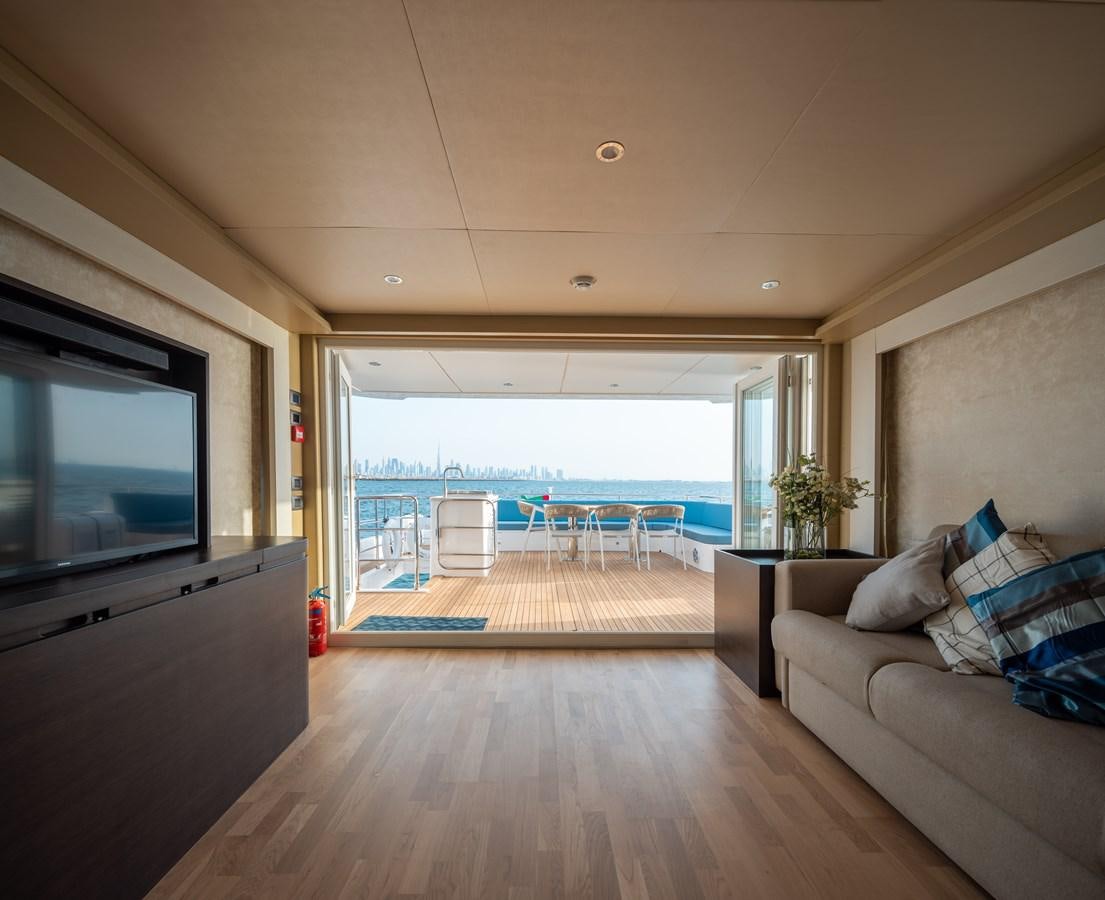 a living room with a large balcony aboard RODINIA 2 Yacht for Sale
