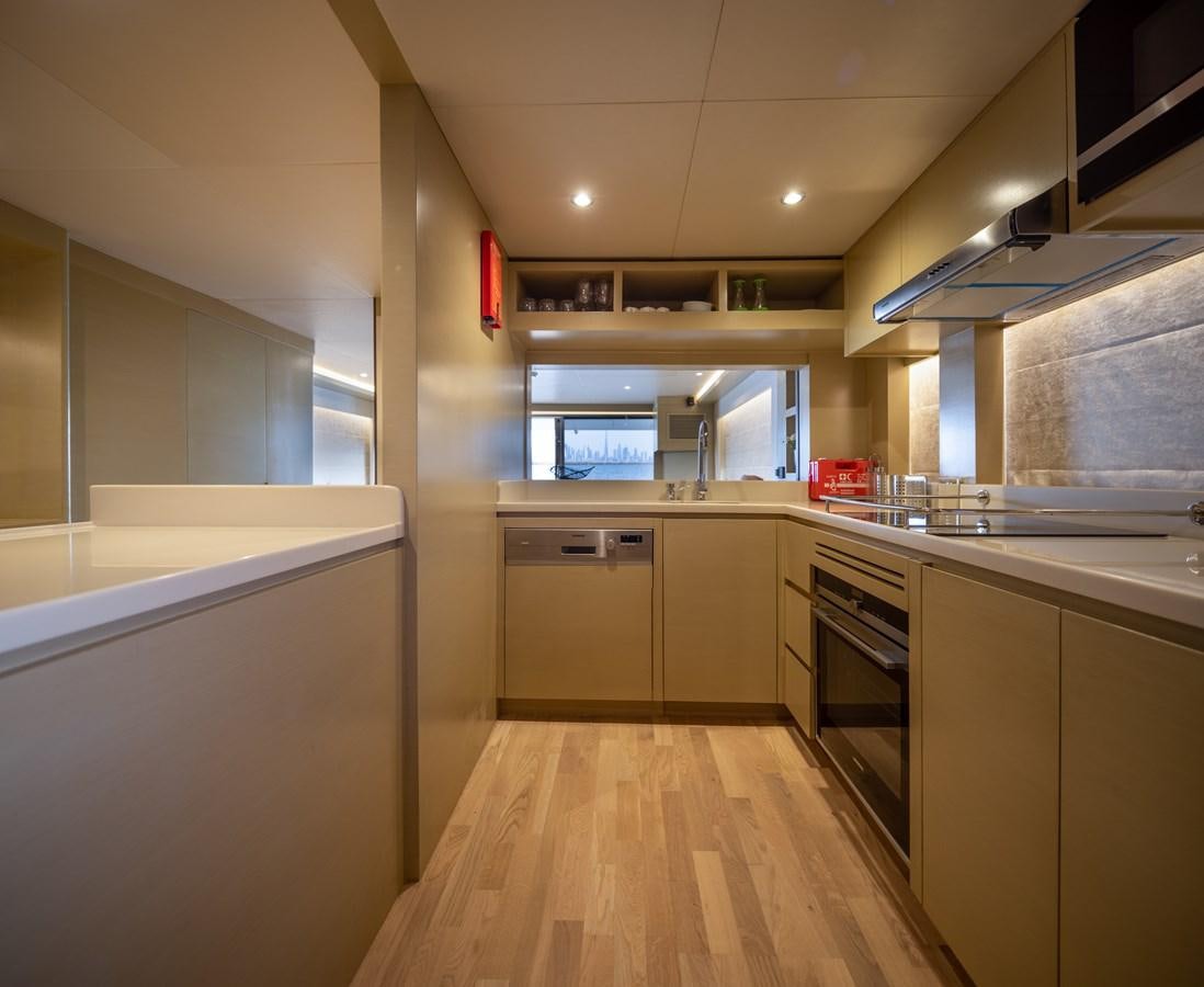 a kitchen with white cabinets aboard RODINIA 2 Yacht for Sale