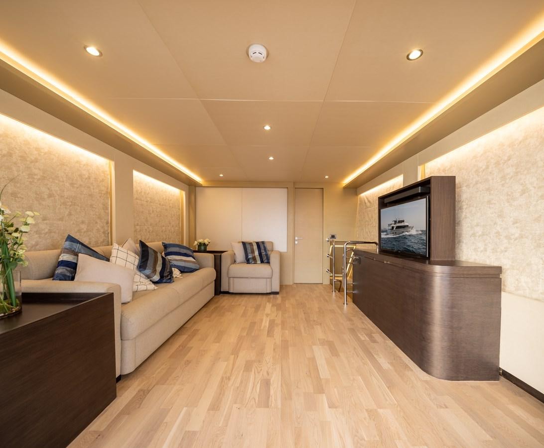 a living room with a wood floor aboard RODINIA 2 Yacht for Sale