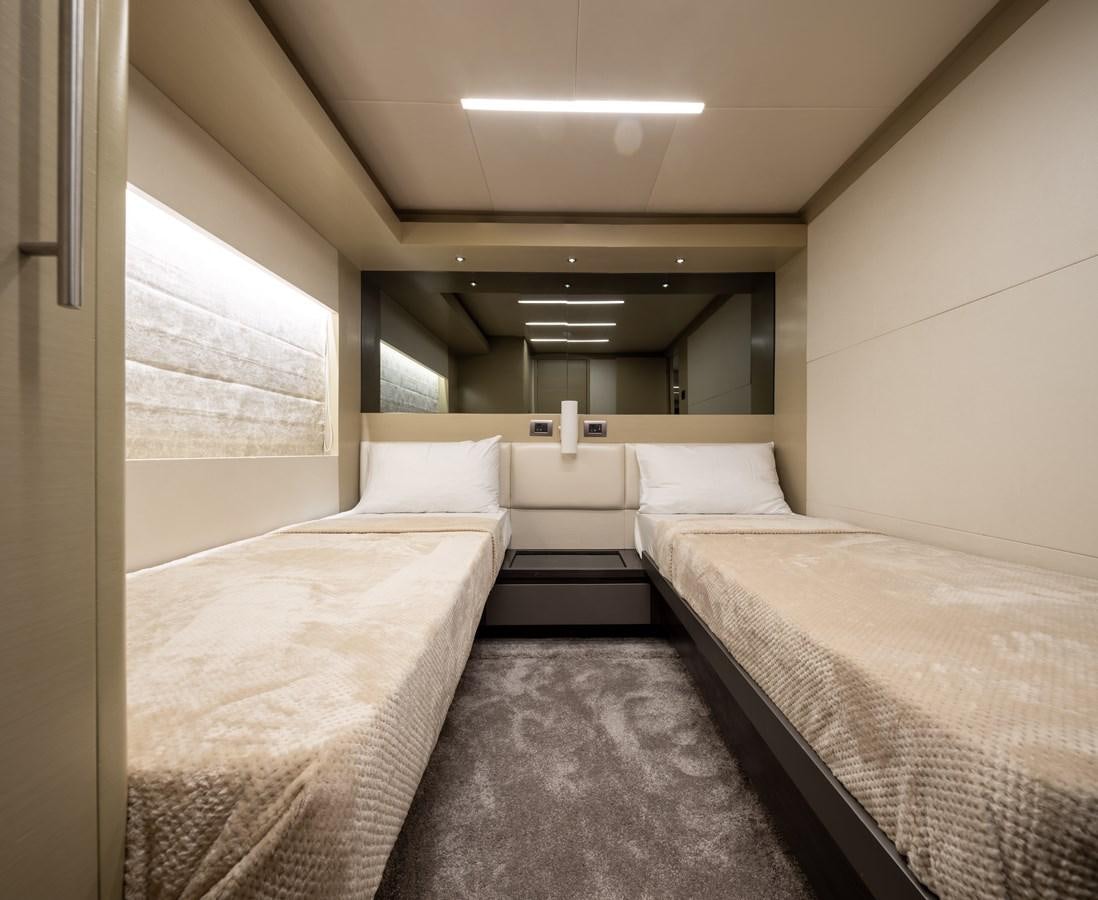 a room with beds and a window aboard RODINIA 2 Yacht for Sale